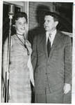 Carroll Gartin standing next to unidentified woman by Author Unknown