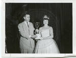 Carroll Gartin presenting trophy to pageant participant by Standard Photo Co. (Jackson, Miss.)