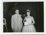 Carroll Gartin presenting trophy to pageant participant by Standard Photo Co. (Jackson, Miss.)