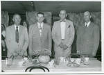 Carroll Gartin standing with three unidentified men by Author Unknown