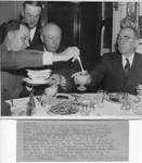 Mayor Louis Braun of Biloxi, Lieut. W. H. Hunt, Pat Harrison and Speaker of the House William Bankhead at dinner. by Acme Newspictures (New York, N.Y.)