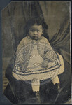 Image 61: Child Sitting in Front of Set With Draping by Author Unknown