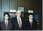 Armis Hawkins with two unidentified staff members, image 001