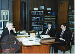 Armis Hawkins with two unidentified staff members, image 002