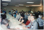 Group of people seated at tables, image 002