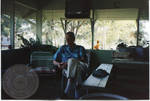 Armis Hawkins seated on porch