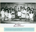 Mayor Eileen Anderson and Mr. Richard Hiramoto, Director of School Food Services, hold the City Proclamation for National School Lunch Week. by Hawaii Donna Matsufuru Collection