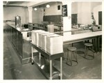 Kitchen Serving Station with Stacks of Metal Trays by Pittsburgh Public Schools