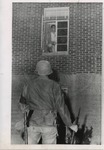 Unidentified student looking out of his window in Lester Hall by Edward Movitz