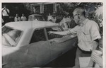 Student points at the car taking James Meredith to class by Edward Movitz