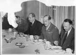 Eastland, Richard B. Russell, Harry F. Byrd, and two military officers in uniform dining on soup. by Author Unknown