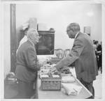 Eastland with Walter H. (Skeet) Hunt as he prepares shrimp for Congressional members. by International News
