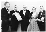 Eastland receiving a certificate from three unidentified men and one unidentified woman by Standard Photo Company (Jackson, Miss.)