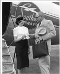 Eastland with Southern Airways stewardess Faye Matthews outside an airplane by Charlie Preston Studios (Birmingham, Ala.)