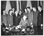 Eastland in White House with President Harry S. Truman and other senators. by Press Association, Inc.