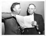 Eastland with Senator Harry Cain examining Bill. by Acme Photographs