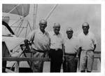 Eastland on boat with unidentified men. by Author Unknown