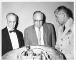 Eastland at Capitol exhibit of the Discoverer XIII Capsule with Charles L. Watkins, State Parliamentarian, and Col. Charles S. Mathison, Discoverer Recovery Operation Officer. by United States. Air Force