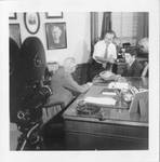 Series of photographs of filmed interview of Eastland by an unidentified man in his Washington, D.C. office. by Author Unknown