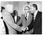 Eastland shaking hands with Anwar Sadat by Author Unknown