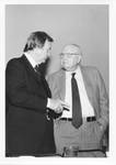Eastland at the 1978 Symposium of Deposit Guaranty National Bank talking to John C. White. by Author Unknown