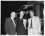 Eastland with two unidentified men in from of Delta C&S Airplane by Delta C&S Airlines (Atlanta, Ga.)