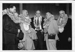 Eastland pictured with four unidentified men wearing Hawaiian leis, image 1 by Honolulu Star Bulletin Press