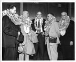 Eastland pictured with four unidentified men wearing Hawaiian leis, image 2 by Honolulu Star Bulletin Press
