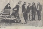 Band photo in front of vintage car, clipped from Clarion Ledger by Kudzu Kings (Musical Group)
