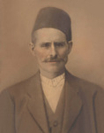 Man wearing Syrian hat by John Michael Tonos Jr.