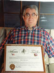 John Leslie holding award. by Author Unknown