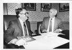 Mayor John Leslie and Dr. David Sansing behind desk. by Author Unknown