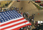 A view of the American Flag in front of the Lafayette County Courthouse, image 001 by Author Unknown