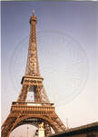 The Eiffel Tower decorated for centennial celebration. by Author Unknown