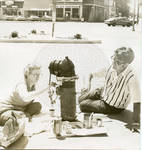 John and Elizabeth Leslie painting a fire hydrant on the Oxford Square for Bicentennial celebrations. by Author Unknown