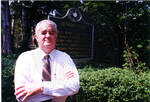 John Leslie in front of sign to William Faulkner residence, Rowan Oak. by Author Unknown