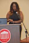 Female student stands at podium, vertical by Mississippi Alliance for Minority Participation