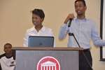 Female and male students stand at podium, horizontal by Mississippi Alliance for Minority Participation