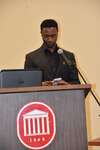 Male student with smartphone at podium, vertical by Mississippi Alliance for Minority Participation