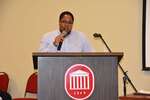 Student in plaid shirt at podium, horizontal by Mississippi Alliance for Minority Participation