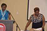 Ms. Vinson at podium, Ms. Brown with box plaques, horizontal by Mississippi Alliance for Minority Participation