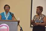 Ms. Vinson at podium, Ms. Brown holding plaque, horizontal by Mississippi Alliance for Minority Participation