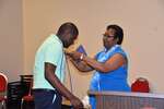 Ms. Vinson presents blue cord to Patrick Johnson, horizontal by Mississippi Alliance for Minority Participation