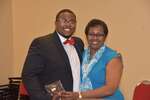 Male student and Ms. Vinson pose and hug by Mississippi Alliance for Minority Participation