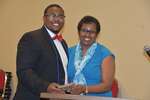 Ms. Vinson and male student hold plaque by Mississippi Alliance for Minority Participation
