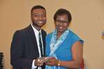 Male student and Ms. Vinson hold plaque by Mississippi Alliance for Minority Participation