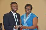 Male student and Ms. Vinson hold plaque (2) by Mississippi Alliance for Minority Participation