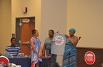 2015. Ms. Vinson holds up Bridge STEM t-shirt with Ms. Brown and female student by Mississippi Alliance for Minority Participation