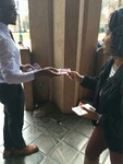 Male student sells a booklet to a female student by Mississippi Alliance for Minority Participation
