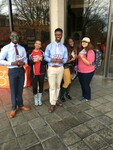 Five students pose with coupon booklets by Mississippi Alliance for Minority Participation